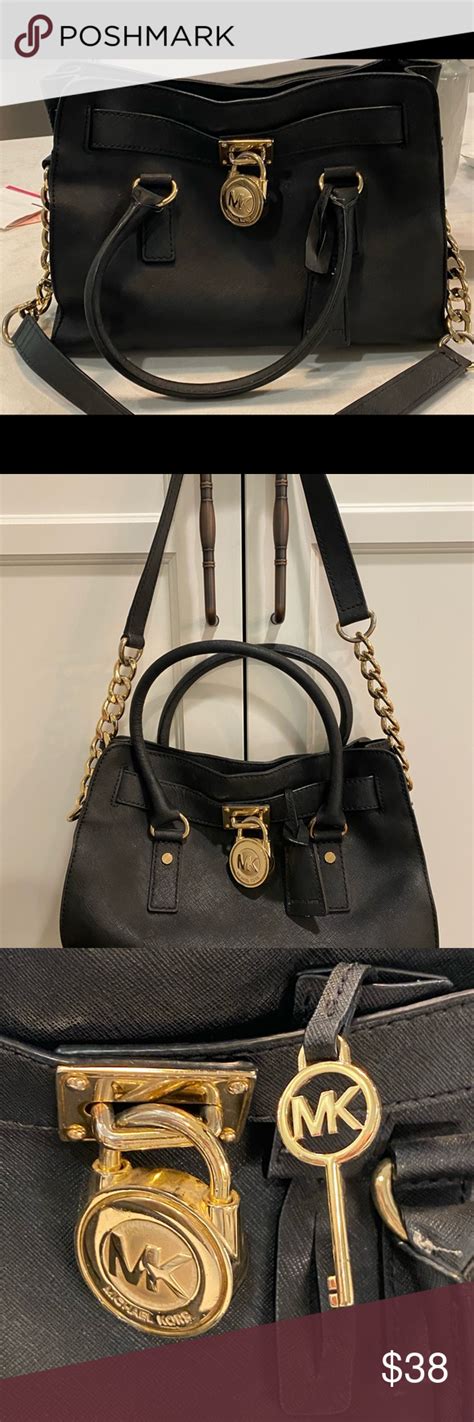 michael kors black purse with gold lock|michael kors linen with gold.